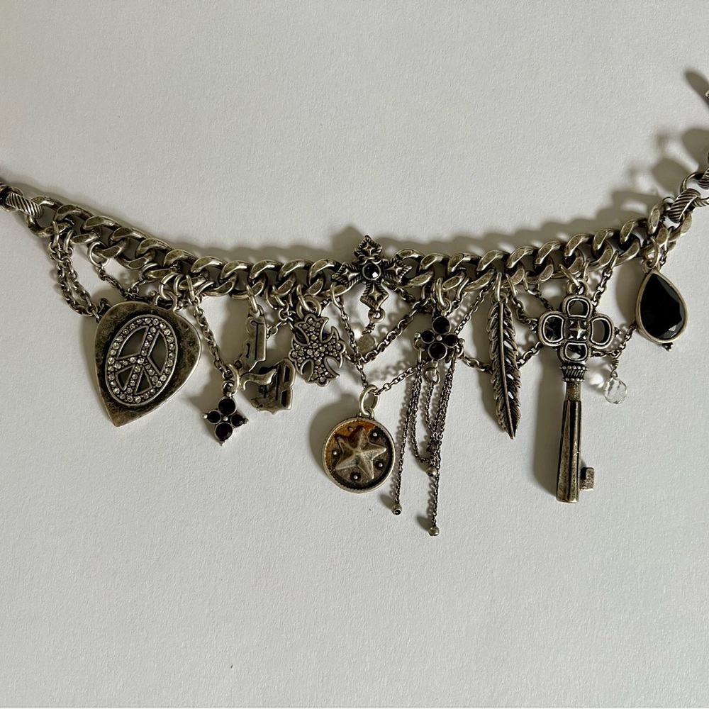 Lucky Brand Vintage Silver Charm Bracelet with numberous charms and dangles.